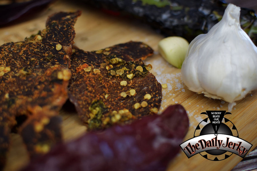 Close up of Christmas beef jerky pieces from The Daily Jerky with Red and Green Chile