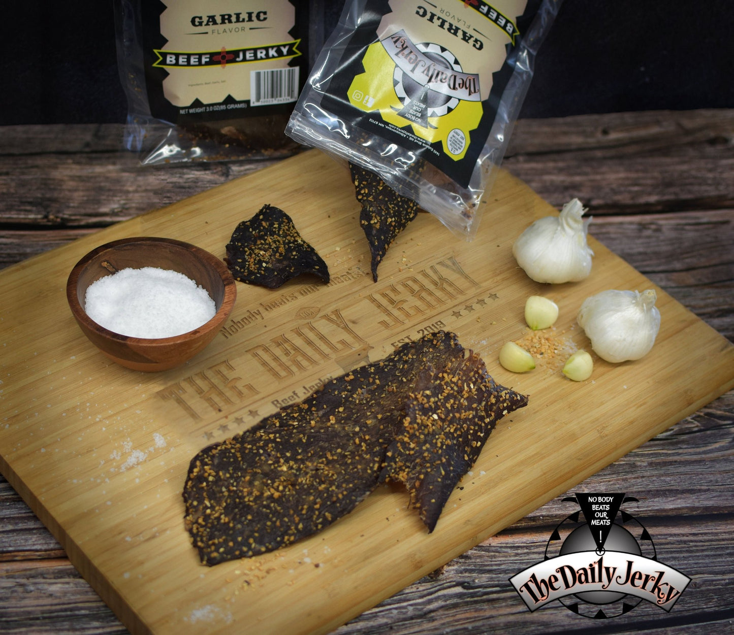 Multiple bags of The Daily Jerky garlic beef jerky stacked together