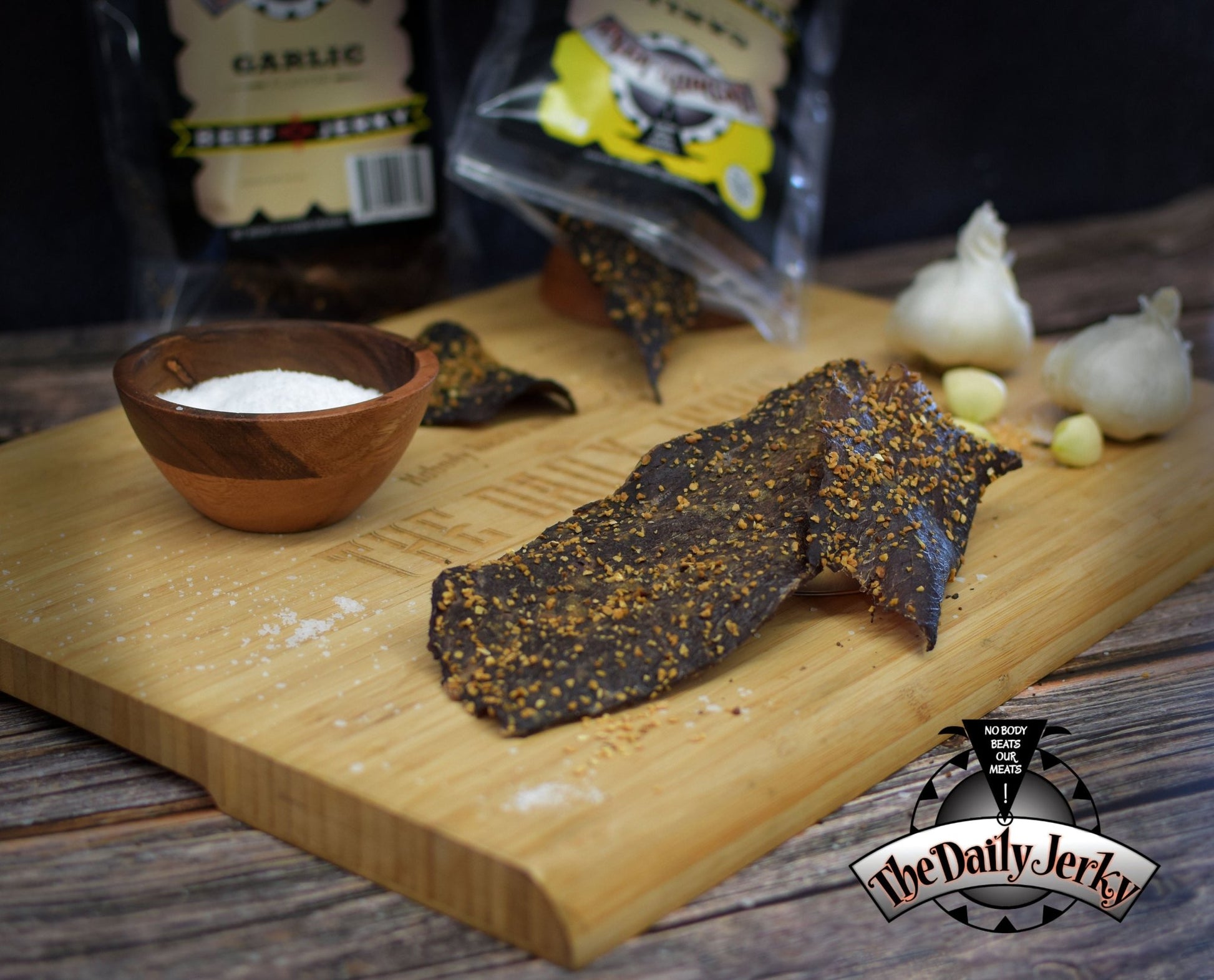 Garlic beef jerky from The Daily Jerky served on a wooden board as a savory snack