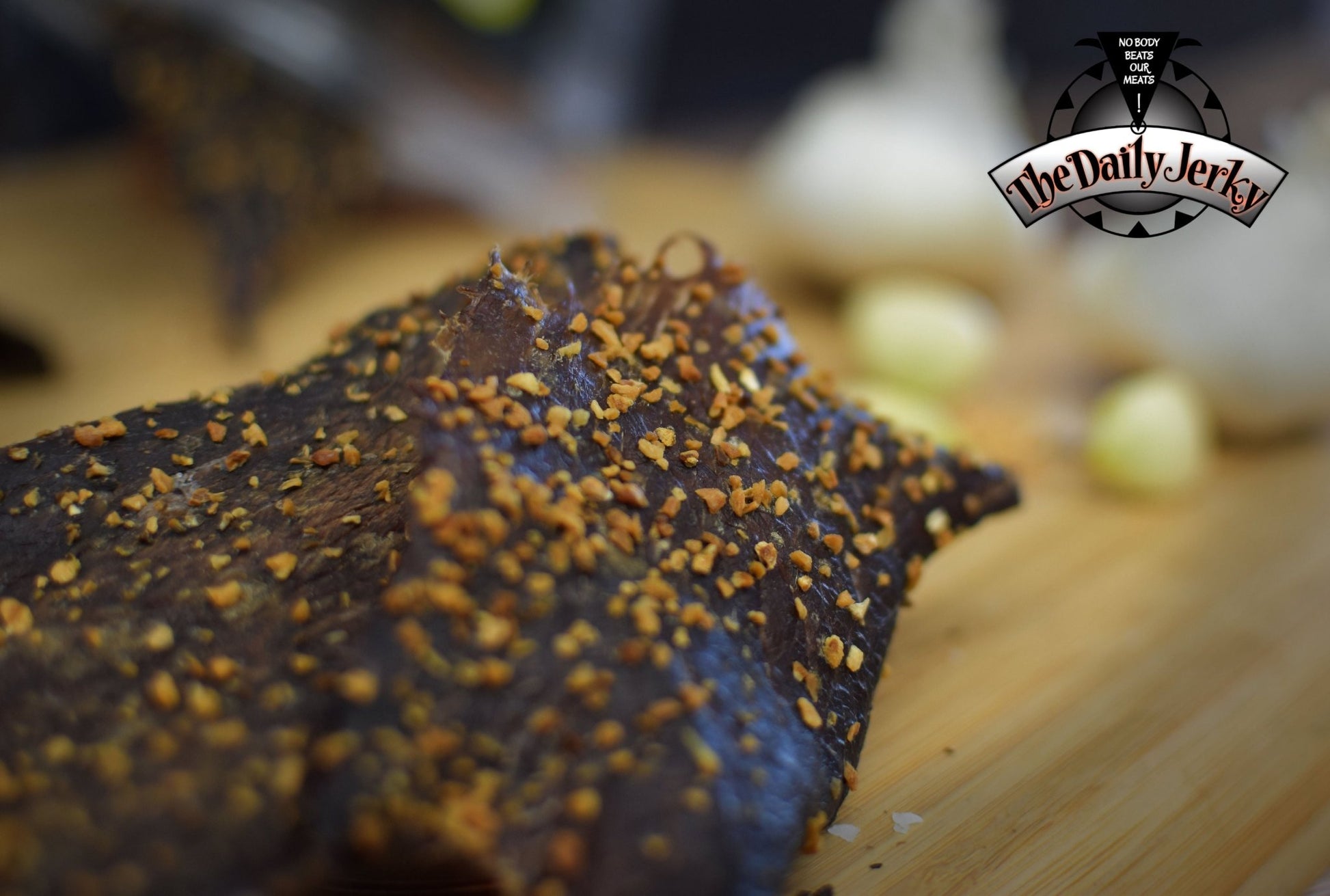 Close up of garlic beef jerky pieces from The Daily Jerky with visible seasoning