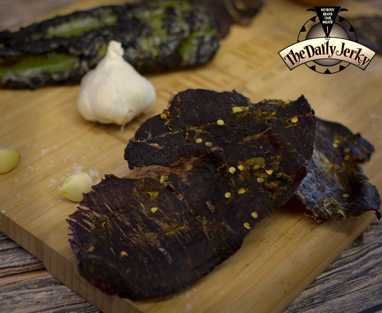 Close up of thin, crispy green Chile beef jerky pieces from The Daily Jerky