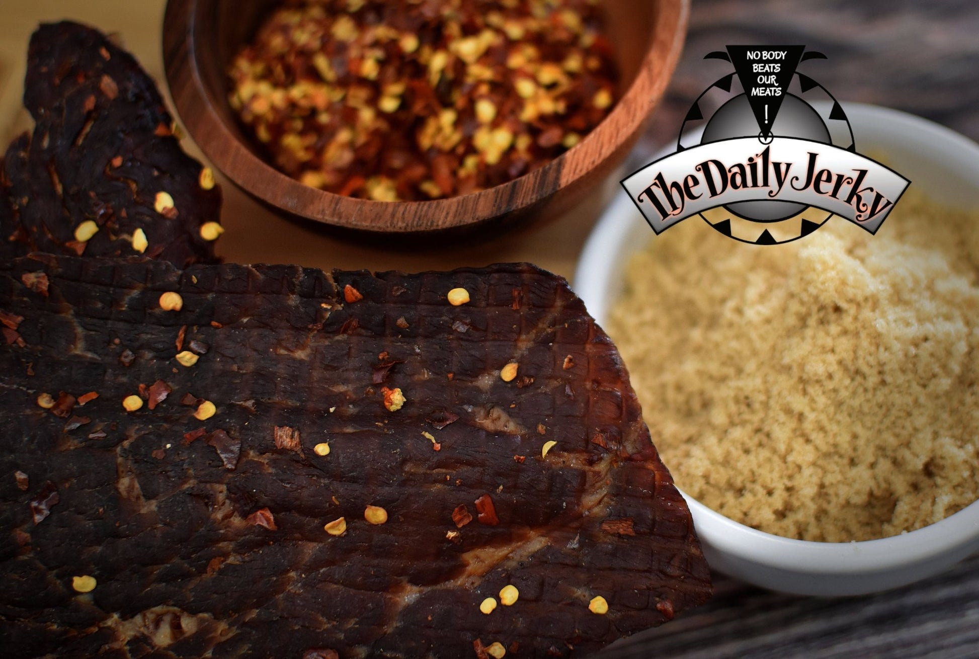 Close up of spicy teriyaki beef jerky pieces from The Daily Jerky showing pepper flakes