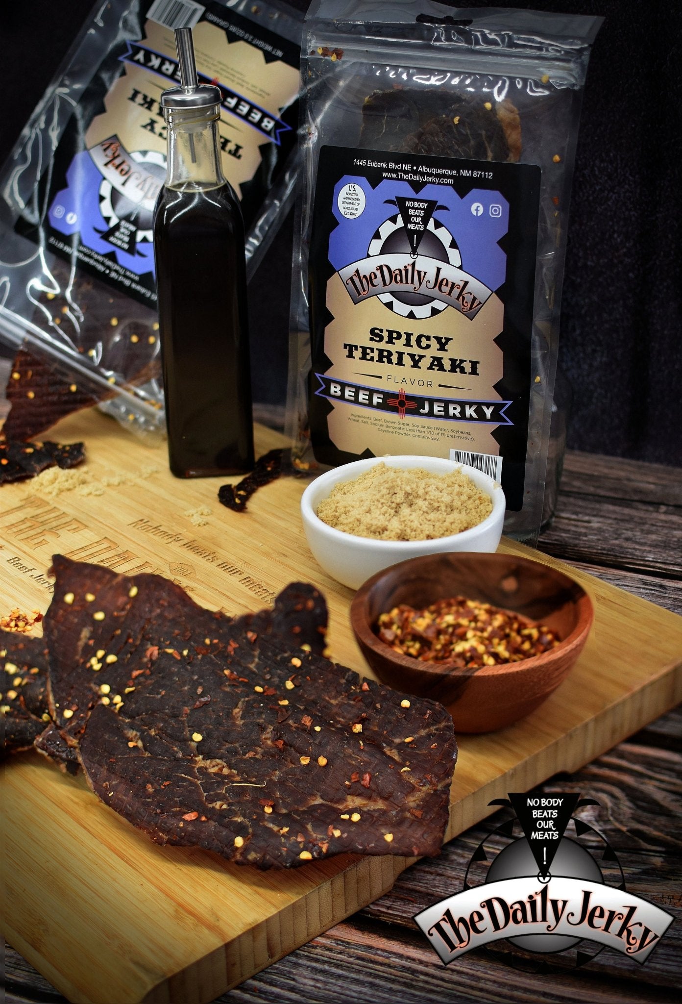 Spicy teriyaki beef jerky from The Daily Jerky served on a wooden board as a bold savory snack